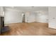 Living room features hardwood floors, brick fireplace, and bright white walls at 403 Abingdon Way, Atlanta, GA 30328