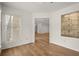 Sunroom features hardwood floors, white walls and large windows for natural light at 403 Abingdon Way, Atlanta, GA 30328