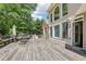 Spacious back deck with an outdoor seating area, perfect for entertaining guests or enjoying a quiet evening at 503 Kensington Estates Trce, Woodstock, GA 30188