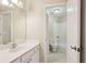 Bathroom featuring a sink, cabinets, and a view into the bathtub at 503 Kensington Estates Trce, Woodstock, GA 30188
