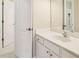 Bathroom featuring white cabinets, countertops, and neutral-colored walls at 503 Kensington Estates Trce, Woodstock, GA 30188