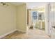 Second full bathroom with a walk-in shower, pedestal sink, toilet and ceramic tile flooring at 503 Kensington Estates Trce, Woodstock, GA 30188