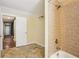 Second full bathroom with a walk-in shower, ceramic tile flooring and toilet at 503 Kensington Estates Trce, Woodstock, GA 30188