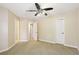 Spacious bedroom featuring a ceiling fan, neutral carpet and fresh paint at 503 Kensington Estates Trce, Woodstock, GA 30188