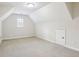 Light and airy bonus room with neutral carpet and fresh paint at 503 Kensington Estates Trce, Woodstock, GA 30188