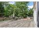 Exterior image of a large wooden deck, perfect for outdoor dining and relaxation at 503 Kensington Estates Trce, Woodstock, GA 30188