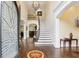 Grand foyer with hardwood floors, high ceilings, and a sweeping staircase at 503 Kensington Estates Trce, Woodstock, GA 30188