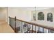 Foyer featuring high ceilings, an ornate railing and view to living room at 503 Kensington Estates Trce, Woodstock, GA 30188