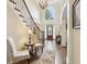 Elegant foyer with a staircase, decor seating, and natural light streaming in at 503 Kensington Estates Trce, Woodstock, GA 30188