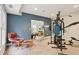 Home gym featuring an expansive wall and several exercise machines at 503 Kensington Estates Trce, Woodstock, GA 30188