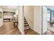Hallway with hardwood floors leads to a recreational room with a pool table at 503 Kensington Estates Trce, Woodstock, GA 30188