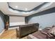 Home theater features a projector screen and comfortable seating at 503 Kensington Estates Trce, Woodstock, GA 30188