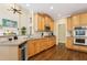 Bright kitchen featuring stainless steel appliances, double oven and view to Gathering room at 503 Kensington Estates Trce, Woodstock, GA 30188