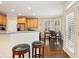 Bright kitchen showcasing wood floors, breakfast nook, and view to kitchen at 503 Kensington Estates Trce, Woodstock, GA 30188