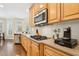 Kitchen with stainless steel appliances, tile backsplash, and granite countertops at 503 Kensington Estates Trce, Woodstock, GA 30188
