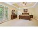 Spacious main bedroom with natural light, tray ceiling, and a ceiling fan at 503 Kensington Estates Trce, Woodstock, GA 30188