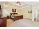 Spacious main bedroom with tray ceiling, ceiling fan, and neutral paint at 503 Kensington Estates Trce, Woodstock, GA 30188