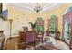 Spacious home office with hardwood floors, large windows, and custom desk at 503 Kensington Estates Trce, Woodstock, GA 30188