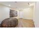 Large recreation room with hardwood floors, recessed lighting, and ample space for activities at 503 Kensington Estates Trce, Woodstock, GA 30188