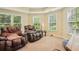 Sitting area with 2 recliner chairs and 3 large windows at 503 Kensington Estates Trce, Woodstock, GA 30188