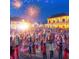 Image of a festive outdoor celebration at night with a crowd and fireworks in the background at 5620 Moresby Ct, Alpharetta, GA 30022