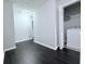 Upstairs hallway has modern flooring leading to the laundry room with a washing machine at 5620 Moresby Ct, Alpharetta, GA 30022