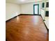 Open basement with hardwood floors and access to the backyard at 225 Colser Dr, Covington, GA 30016