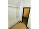 Bathroom showing a tub/shower and a view into the walk-in closet at 225 Colser Dr, Covington, GA 30016