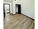 Bedroom featuring hardwood floors, a walk-in closet, and a neutral color scheme at 225 Colser Dr, Covington, GA 30016