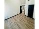 Bedroom featuring hardwood floors and a view into the bathroom at 225 Colser Dr, Covington, GA 30016