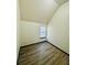 Bedroom with sloped ceiling, wood-look flooring and bright window at 225 Colser Dr, Covington, GA 30016