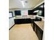 Functional kitchen with dark cabinetry, modern appliances, and laminate countertops at 225 Colser Dr, Covington, GA 30016