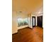 Cozy living room featuring hardwood flooring, large windows, and neutral paint at 225 Colser Dr, Covington, GA 30016