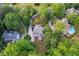 Expansive aerial view of the home featuring lush landscaping, pool, and a lengthy driveway at 2655 Boulder Creek Ne Dr, Roswell, GA 30075
