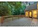 Expansive wooden back deck with lush greenery and nature views at 2655 Boulder Creek Ne Dr, Roswell, GA 30075