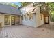 Exterior patio with a wooden deck and back view of house; features multiple windows and doors to enter home at 2655 Boulder Creek Ne Dr, Roswell, GA 30075