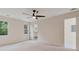 Spacious carpeted bedroom boasting a ceiling fan, windows, and closet with a ladder at 2655 Boulder Creek Ne Dr, Roswell, GA 30075