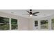 Bright bedroom featuring multiple windows overlooking the outdoors and a ceiling fan at 2655 Boulder Creek Ne Dr, Roswell, GA 30075