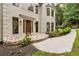 A close up of a front entrance with a stone walkway and a concrete path leading up to the door at 2655 Boulder Creek Ne Dr, Roswell, GA 30075