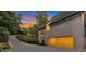 Spacious garage of this two-story home with a long driveway and lush trees at 2655 Boulder Creek Ne Dr, Roswell, GA 30075