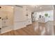 Large open kitchen with ample cabinets, a stainless refrigerator, a separate bar area, and hardwood floors at 2655 Boulder Creek Ne Dr, Roswell, GA 30075