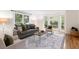 Comfortable living room with plush seating, soft lighting, and a view of the greenery outside at 2655 Boulder Creek Ne Dr, Roswell, GA 30075