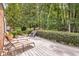 Backyard deck with lots of green landscaping at 3792 Harts Mill Ne Ln, Brookhaven, GA 30319