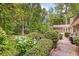 Secluded backyard featuring beautiful flowers, lush greenery, and a serene outdoor setting, perfect for relaxation at 3792 Harts Mill Ne Ln, Brookhaven, GA 30319