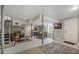 Spacious basement with a dining table and access to stairs and an exterior door at 3792 Harts Mill Ne Ln, Brookhaven, GA 30319