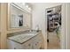 Bathroom with a granite vanity top and walk-in closet at 3792 Harts Mill Ne Ln, Brookhaven, GA 30319
