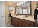 Bathroom with dual sinks, granite countertops, and decorative fixtures at 3792 Harts Mill Ne Ln, Brookhaven, GA 30319