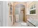 Bathroom featuring a glass shower with marble tile and granite countertop at 3792 Harts Mill Ne Ln, Brookhaven, GA 30319
