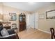 Bedroom featuring a desk, ample lighting, and hardwood floors at 3792 Harts Mill Ne Ln, Brookhaven, GA 30319