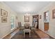 Well-lit dining area with hardwood floors, chandelier and easy access to the kitchen at 3792 Harts Mill Ne Ln, Brookhaven, GA 30319
